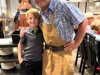 
                  Cowboy and child take a smile for a photo