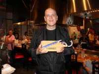 
                  Person holding custom cutting board and chopsticks