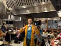 
                  Mad Hatter with thumbs up at hibachi