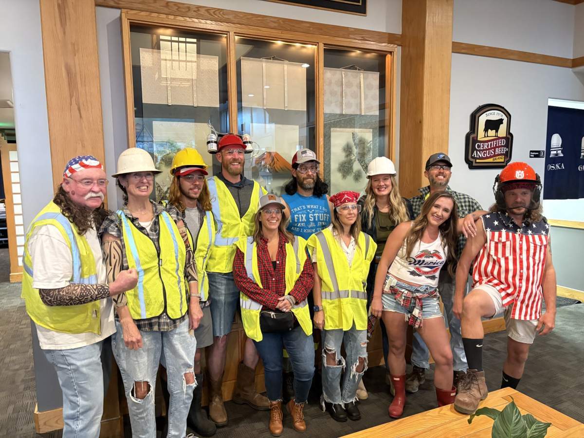 Group of construction workers smiling for a photo