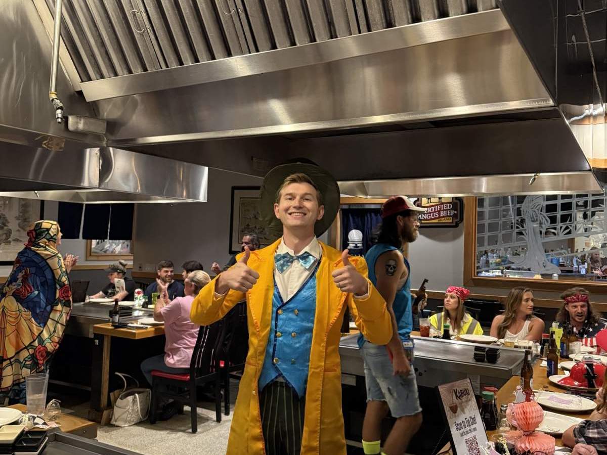 Mad Hatter with thumbs up at hibachi